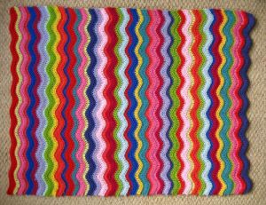 The happily expecting Ms. Lucy would like you to see the lovely ripple baby blanket she has just finished making! ^_-